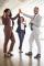 Happy business team celebrating success. Full length view of cheerful male and female business colleagues giving high five and smiling at camera. Teamwork concept